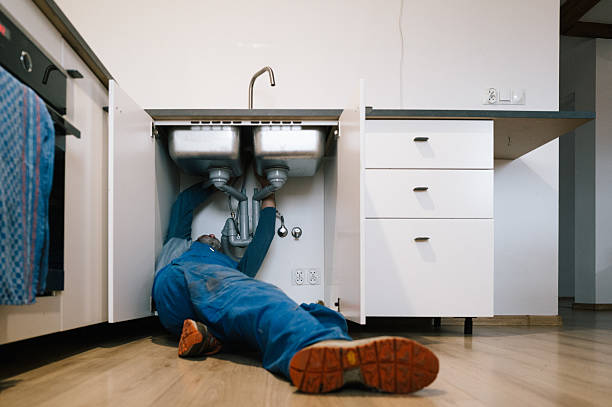 Professional Emergency Plumber technician working in Webster, KY
